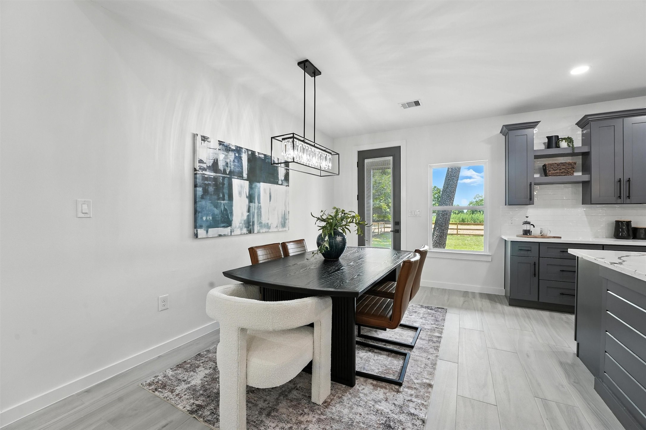256 Davis Bend Road Alvin, TX 77511 - Photo 6 of 34 a kitchen with a sink cabinets and wooden floor