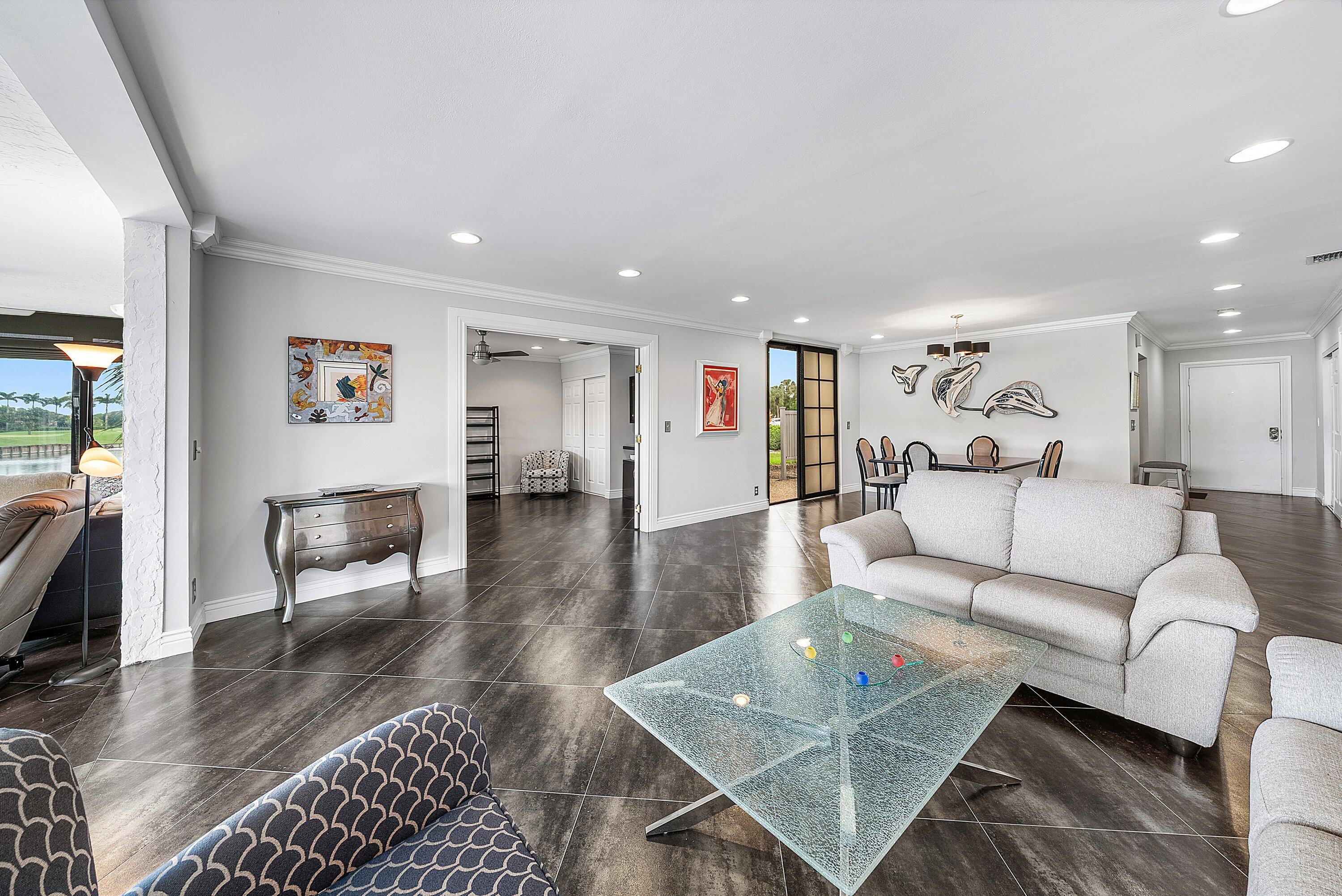 23 Eastgate Drive, Unit C Boynton Beach, FL 33436 - Photo 11 of 71 a living room with furniture and a rug