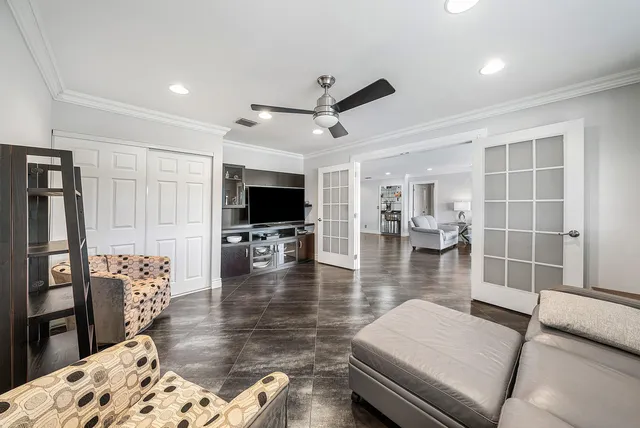 a kitchen with stainless steel appliances wooden cabinets a sink and a stove