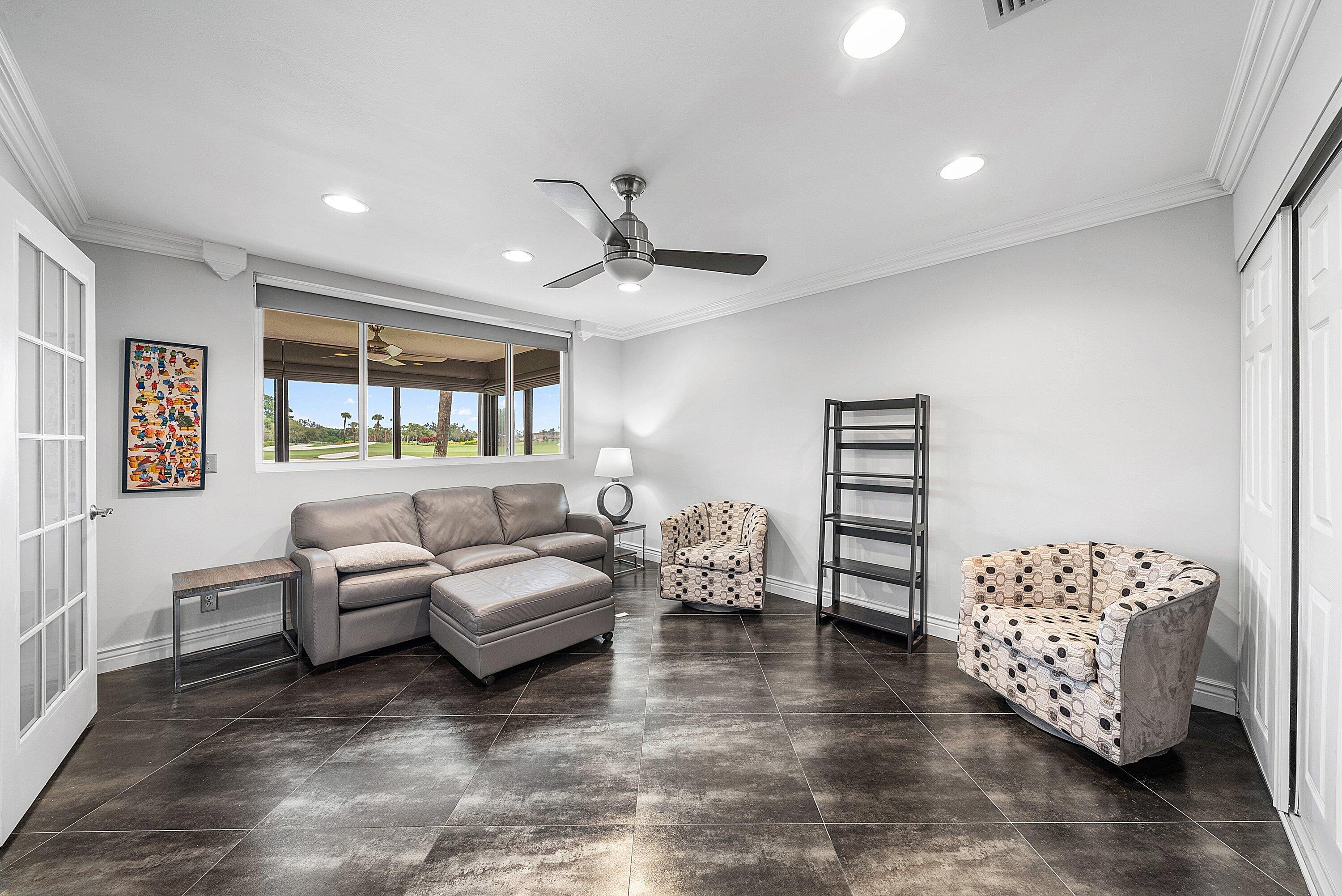 23 Eastgate Drive, Unit C Boynton Beach, FL 33436 - Photo 14 of 71 a living room with furniture and a window