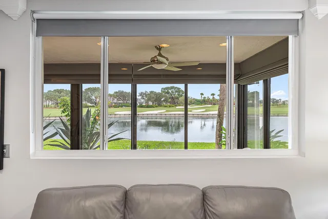 a kitchen with stainless steel appliances granite countertop a sink a stove top oven a refrigerator with grey cabinets