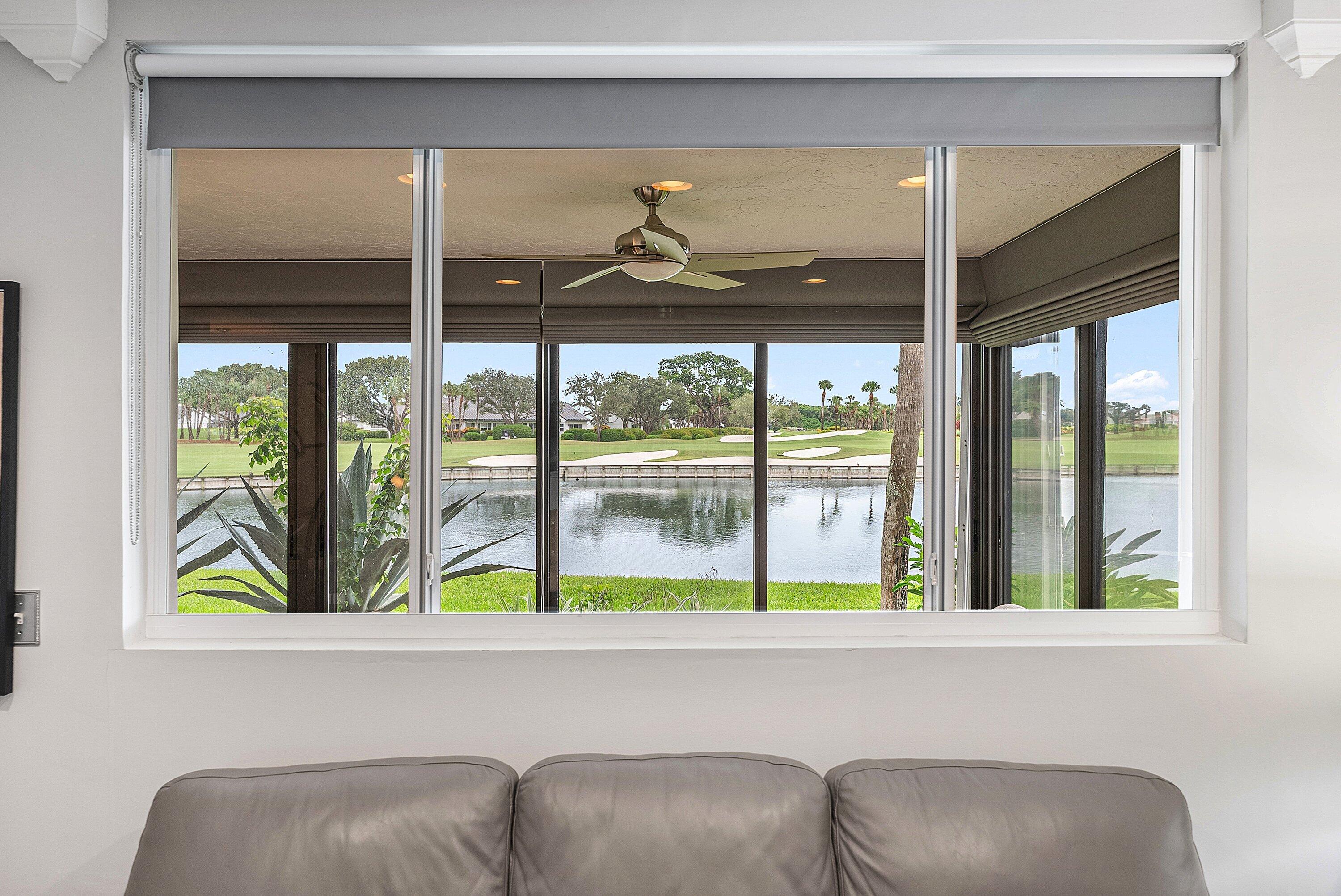 23 Eastgate Drive, Unit C Boynton Beach, FL 33436 - Photo 15 of 71 a living room filled with furniture and a large window