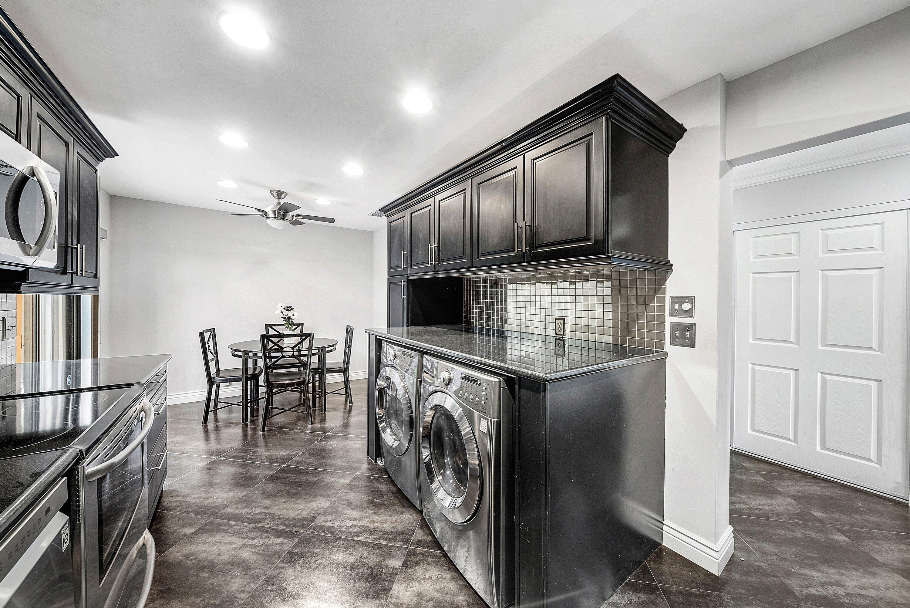 23 Eastgate Drive, Unit C Boynton Beach, FL 33436 - Photo 20 of 71 a kitchen with a stove top oven a sink and a refrigerator