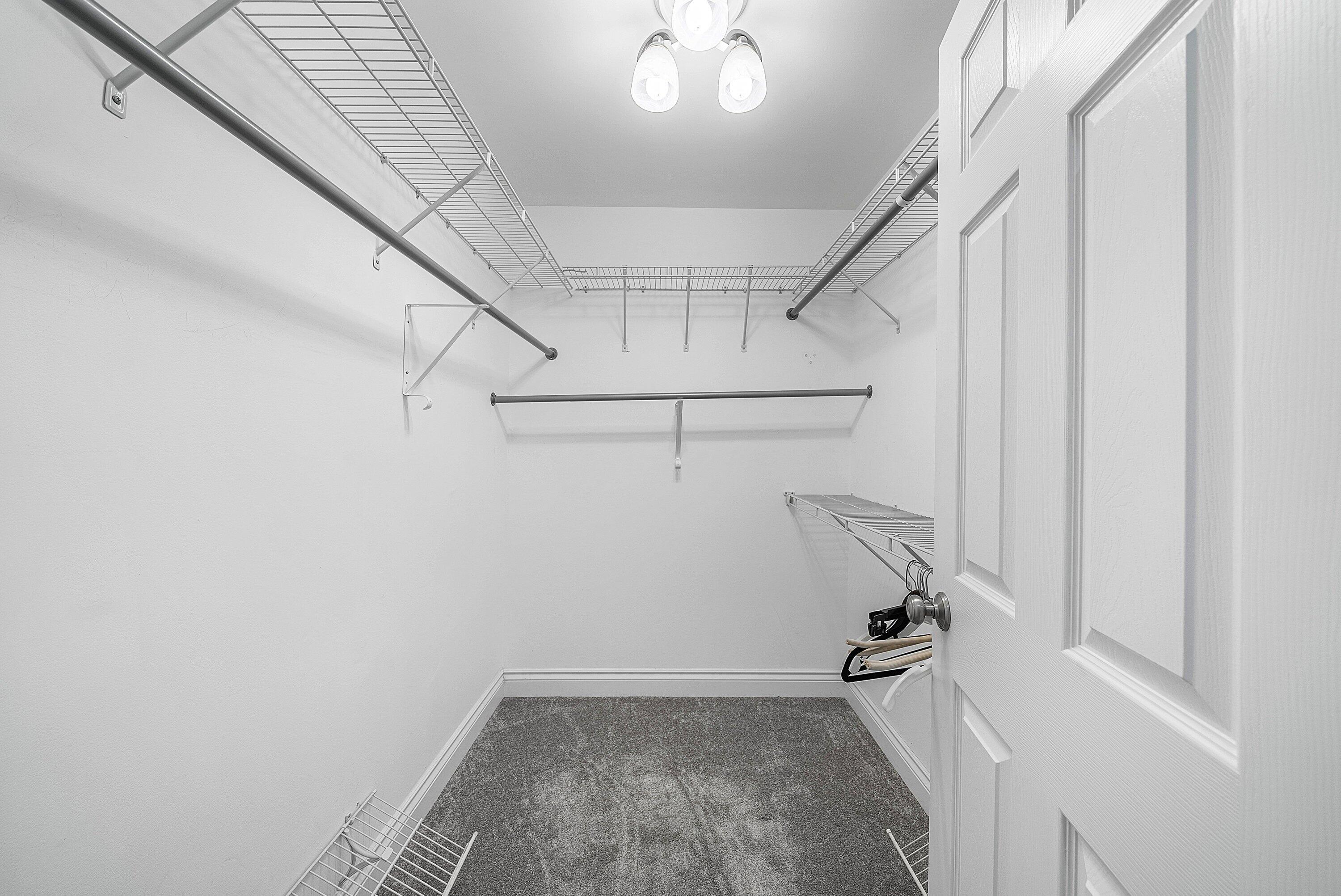 23 Eastgate Drive, Unit C Boynton Beach, FL 33436 - Photo 27 of 71 a view of a room with racks on the wall