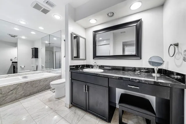 an aerial view of a house with a yard and lake view