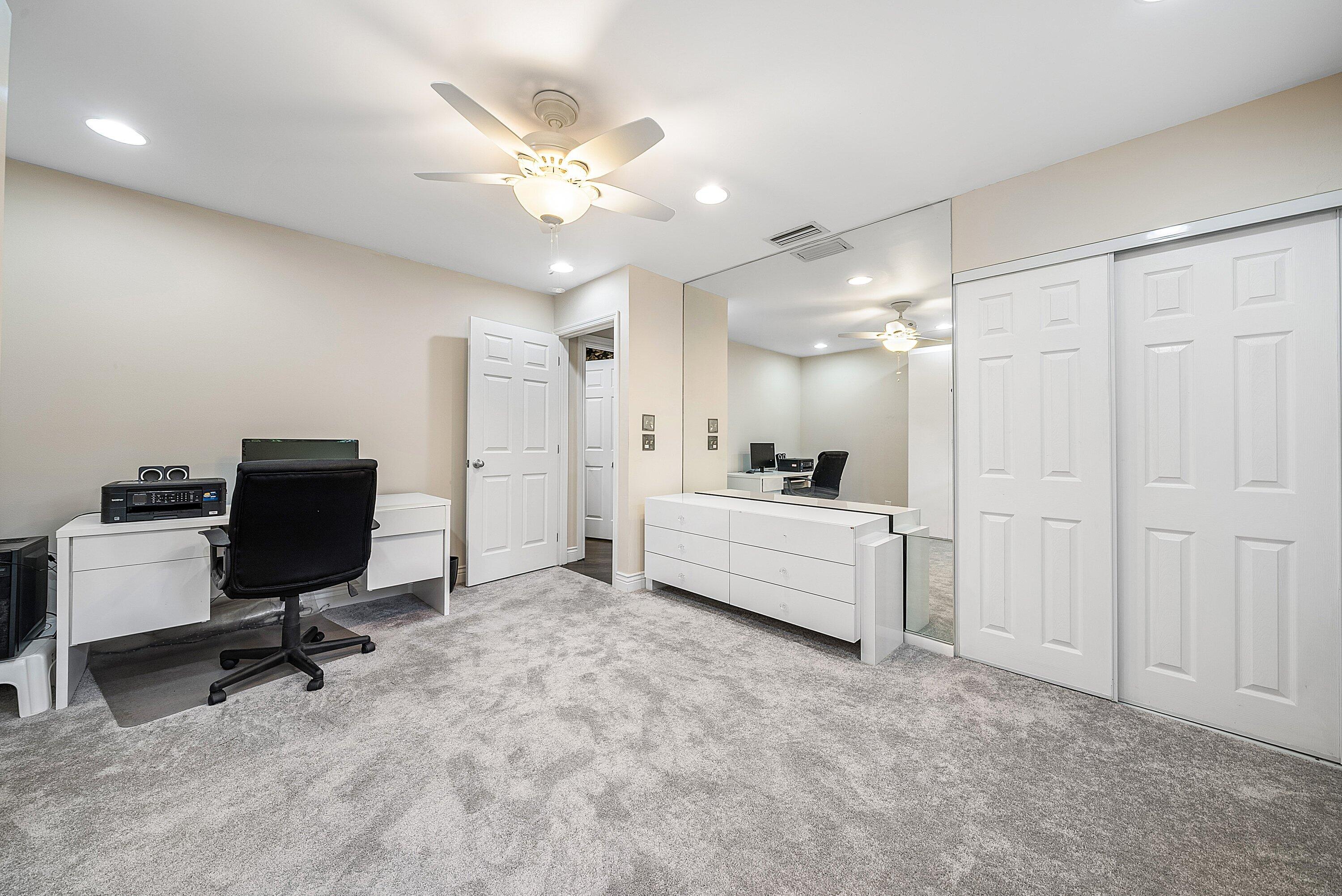 23 Eastgate Drive, Unit C Boynton Beach, FL 33436 - Photo 31 of 71 a view of a workspace with furniture and a bathroom