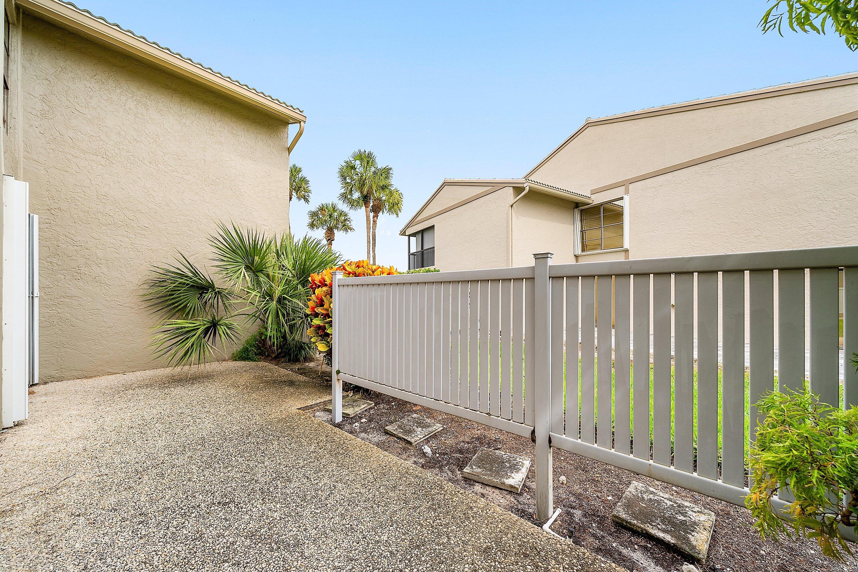 23 Eastgate Drive, Unit C Boynton Beach, FL 33436 - Photo 33 of 71 a view of a house with backyard and plants