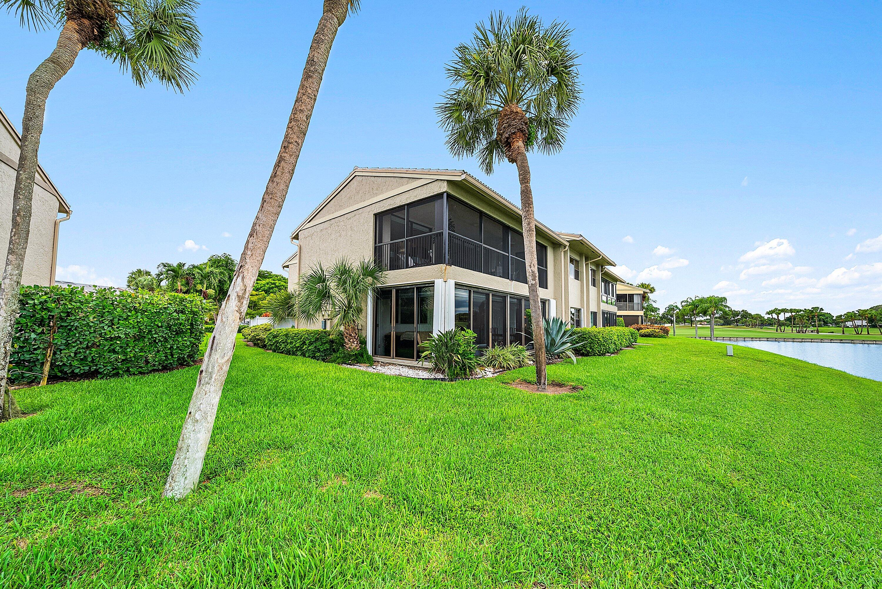 23 Eastgate Drive, Unit C Boynton Beach, FL 33436 - Photo 35 of 71 a house with green field in front of it