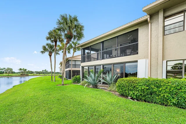 a living room filled with furniture and a large window