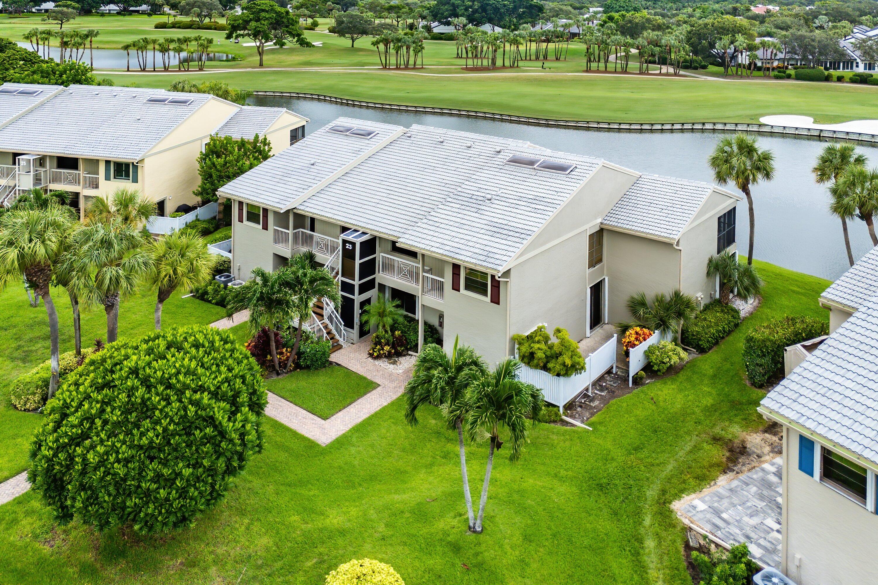 23 Eastgate Drive, Unit C Boynton Beach, FL 33436 - Photo 41 of 71 an aerial view of a house with a yard and lake view