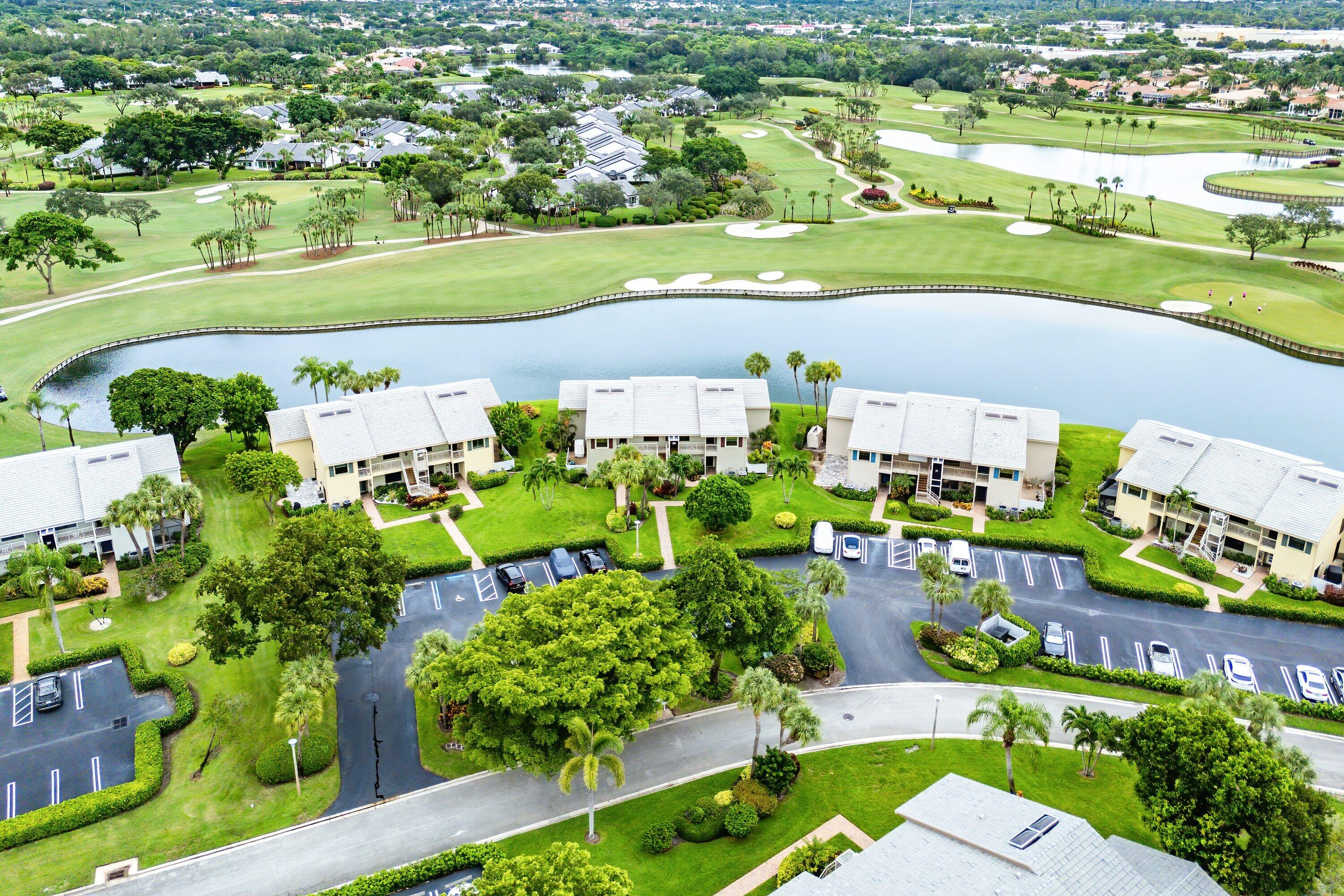 23 Eastgate Drive, Unit C Boynton Beach, FL 33436 - Photo 43 of 71 an aerial view of a houses with outdoor space and street view