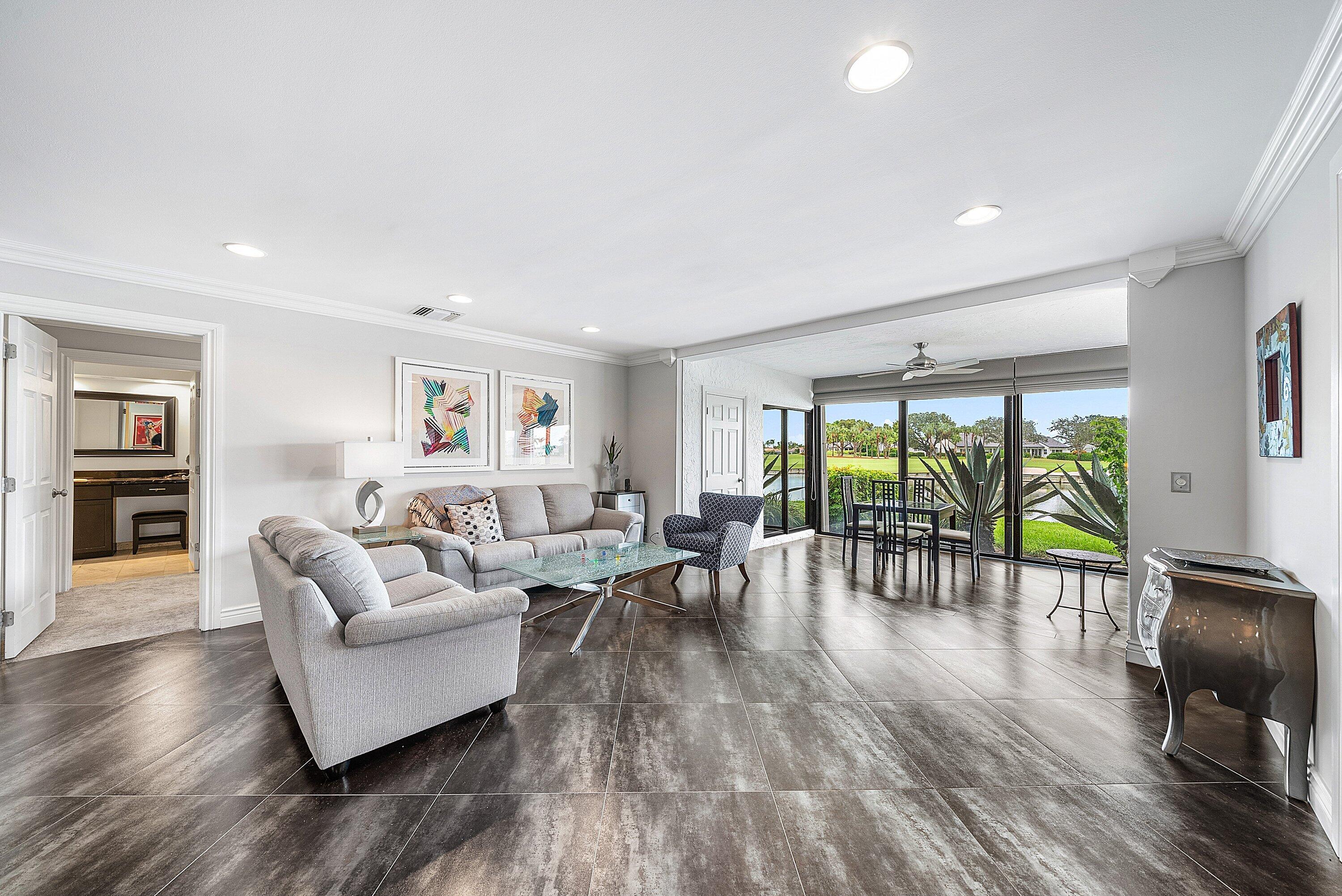 23 Eastgate Drive, Unit C Boynton Beach, FL 33436 - Photo 9 of 71 a living room with furniture and a wooden floor