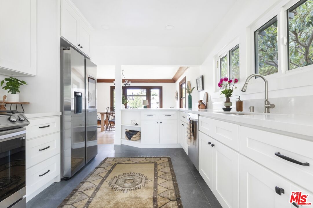 5228 Eagle Rock Boulevard Los Angeles, CA 90041 - Photo 19 of 51 a bathroom with a tub sink and mirror
