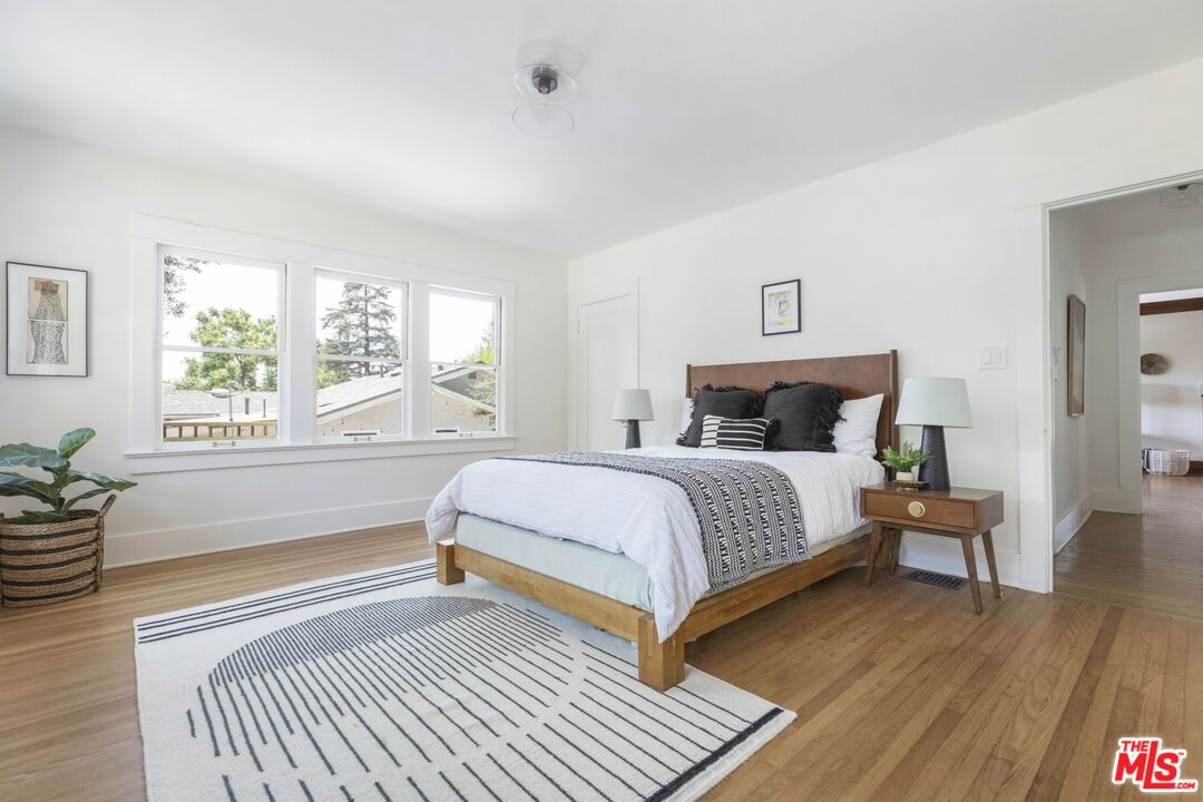 5228 Eagle Rock Boulevard Los Angeles, CA 90041 - Photo 22 of 51 a bedroom with a bed and wooden floor
