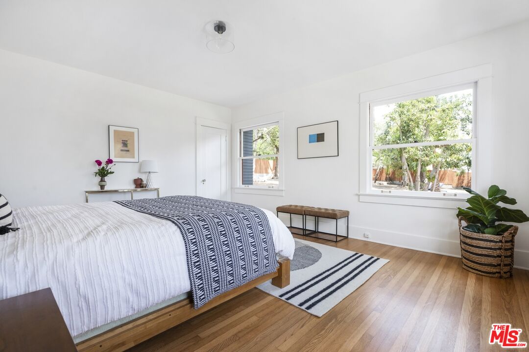 5228 Eagle Rock Boulevard Los Angeles, CA 90041 - Photo 23 of 51 a bedroom with a bed and wooden floor