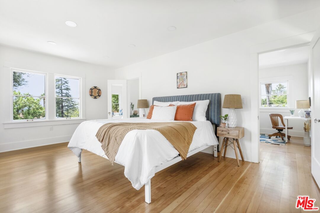 5228 Eagle Rock Boulevard Los Angeles, CA 90041 - Photo 29 of 51 a bedroom with a bed and wooden floor