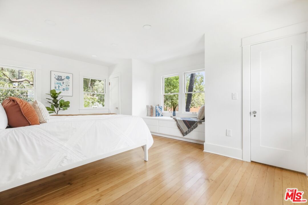 5228 Eagle Rock Boulevard Los Angeles, CA 90041 - Photo 30 of 51 a spacious bedroom with a large bed and wooden floor