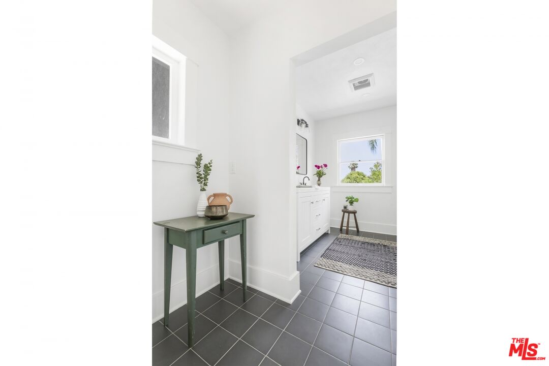 5228 Eagle Rock Boulevard Los Angeles, CA 90041 - Photo 32 of 51 a hallway with a table and a stove