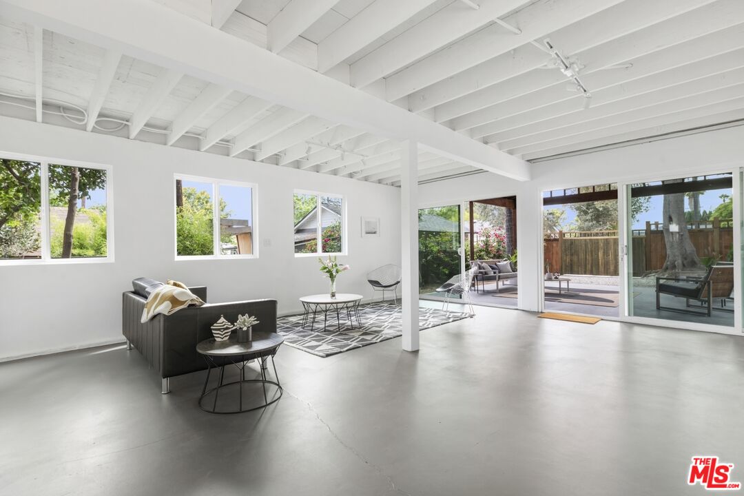 5228 Eagle Rock Boulevard Los Angeles, CA 90041 - Photo 38 of 51 a living room with furniture and floor to ceiling windows