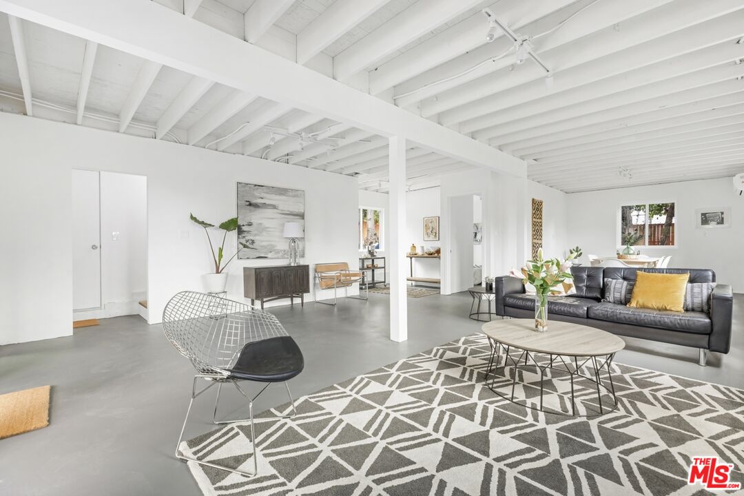 5228 Eagle Rock Boulevard Los Angeles, CA 90041 - Photo 39 of 51 a living room with furniture and a rug