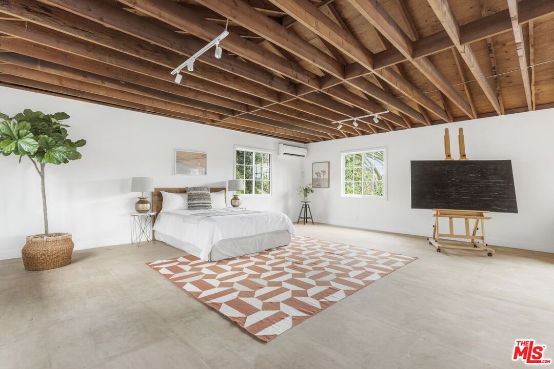 5228 Eagle Rock Boulevard Los Angeles, CA 90041 - Photo 42 of 51 a bedroom with furniture and a flat screen tv