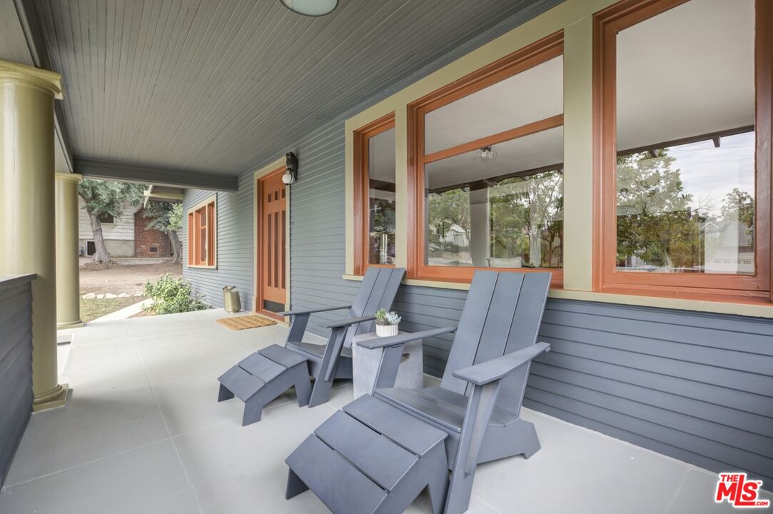 5228 Eagle Rock Boulevard Los Angeles, CA 90041 - Photo 8 of 51 a living room with furniture and large windows