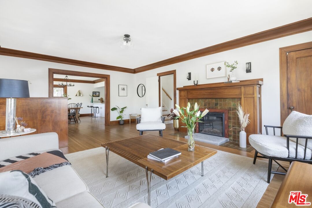 5228 Eagle Rock Boulevard Los Angeles, CA 90041 - Photo 10 of 51 a living room with furniture a rug and a fireplace