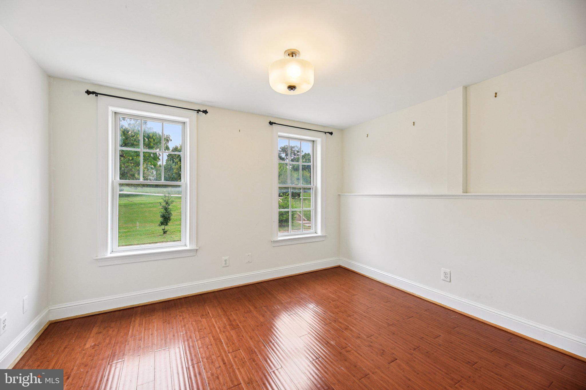 2341 Eastern Avenue Baltimore, MD 21224 - Photo 12 of 43 an empty room with wooden floor and windows