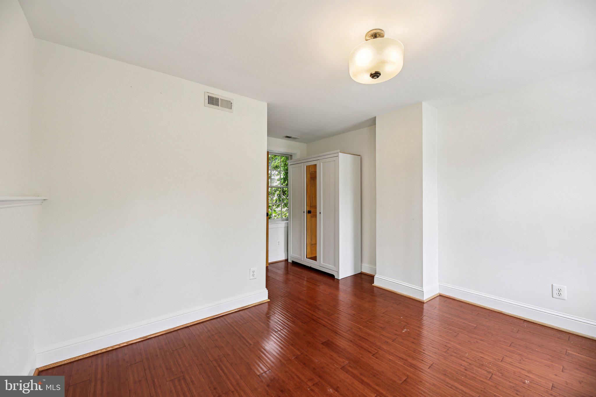 2341 Eastern Avenue Baltimore, MD 21224 - Photo 13 of 43 a view of an empty room with wooden floor