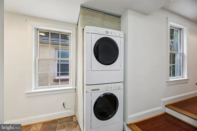 a view of a hallway with washer and dryer