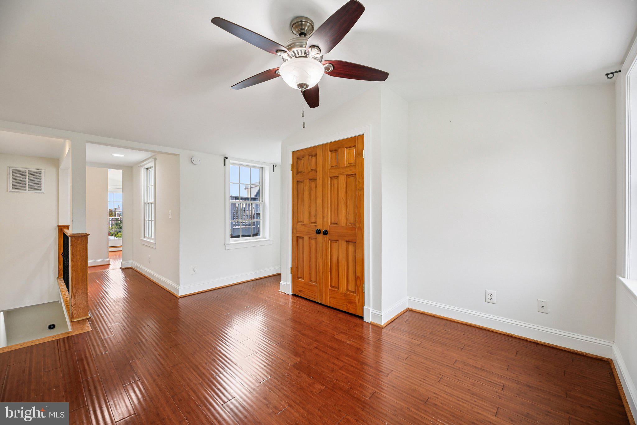 2341 Eastern Avenue Baltimore, MD 21224 - Photo 19 of 43 a view of an empty room with wooden floor
