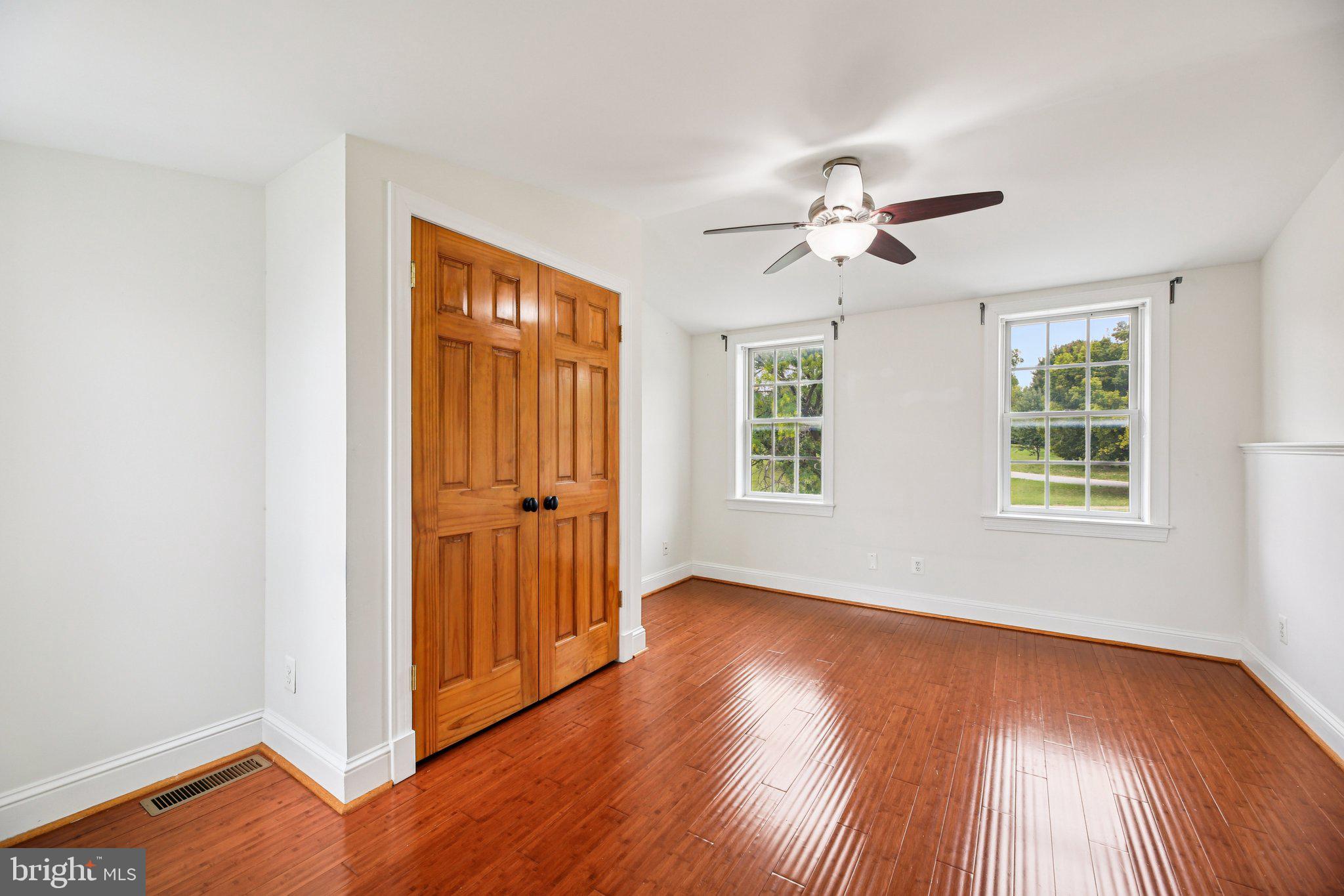 2341 Eastern Avenue Baltimore, MD 21224 - Photo 20 of 43 wooden floor in an empty room with a window