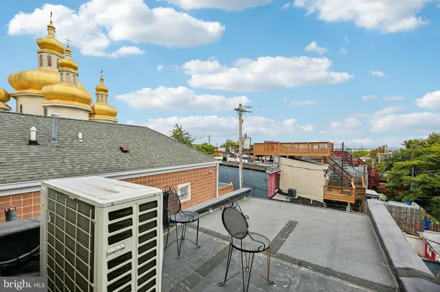 a balcony view with a seating space