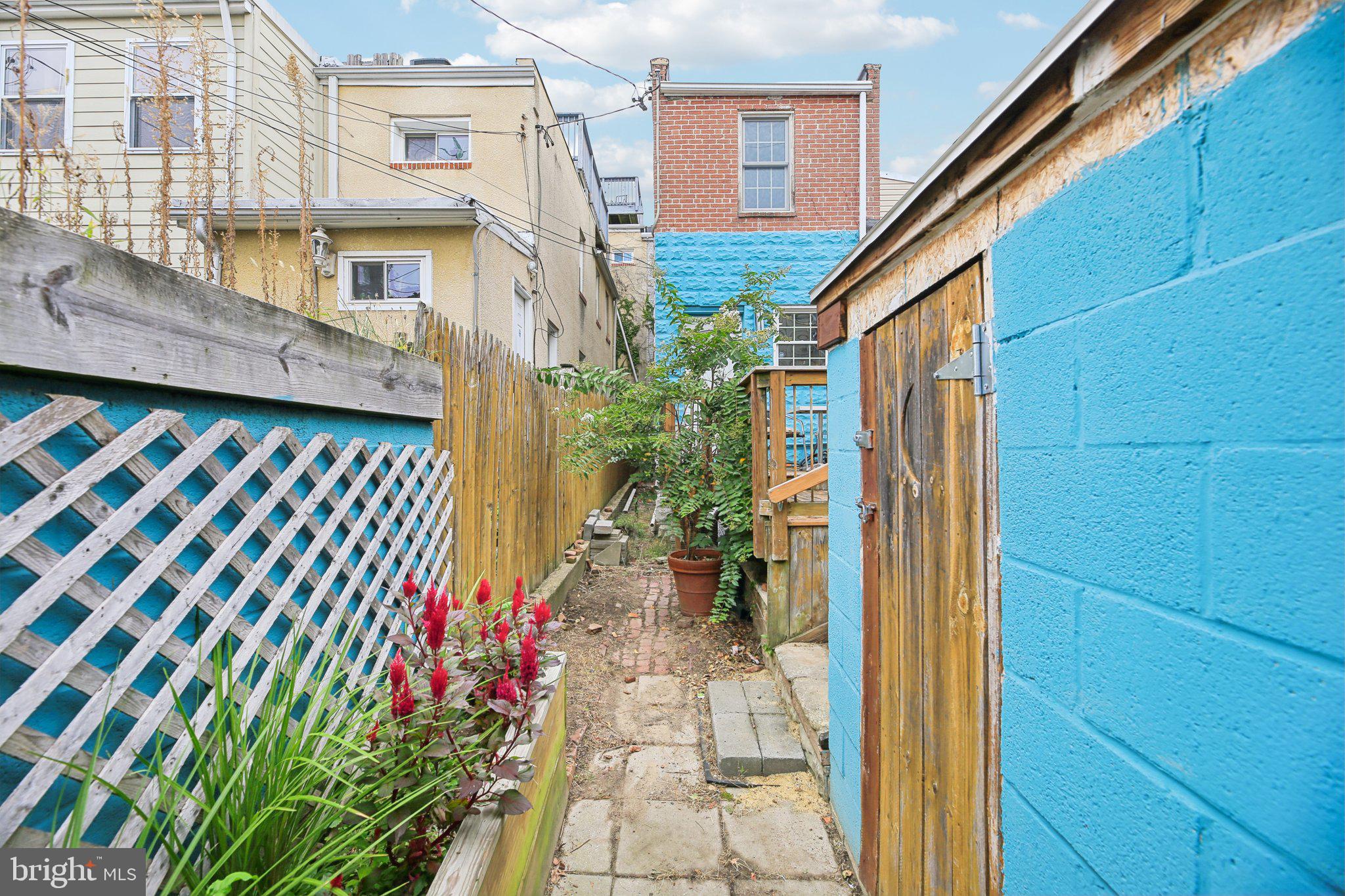 2341 Eastern Avenue Baltimore, MD 21224 - Photo 26 of 43 a front view of a house with a garden