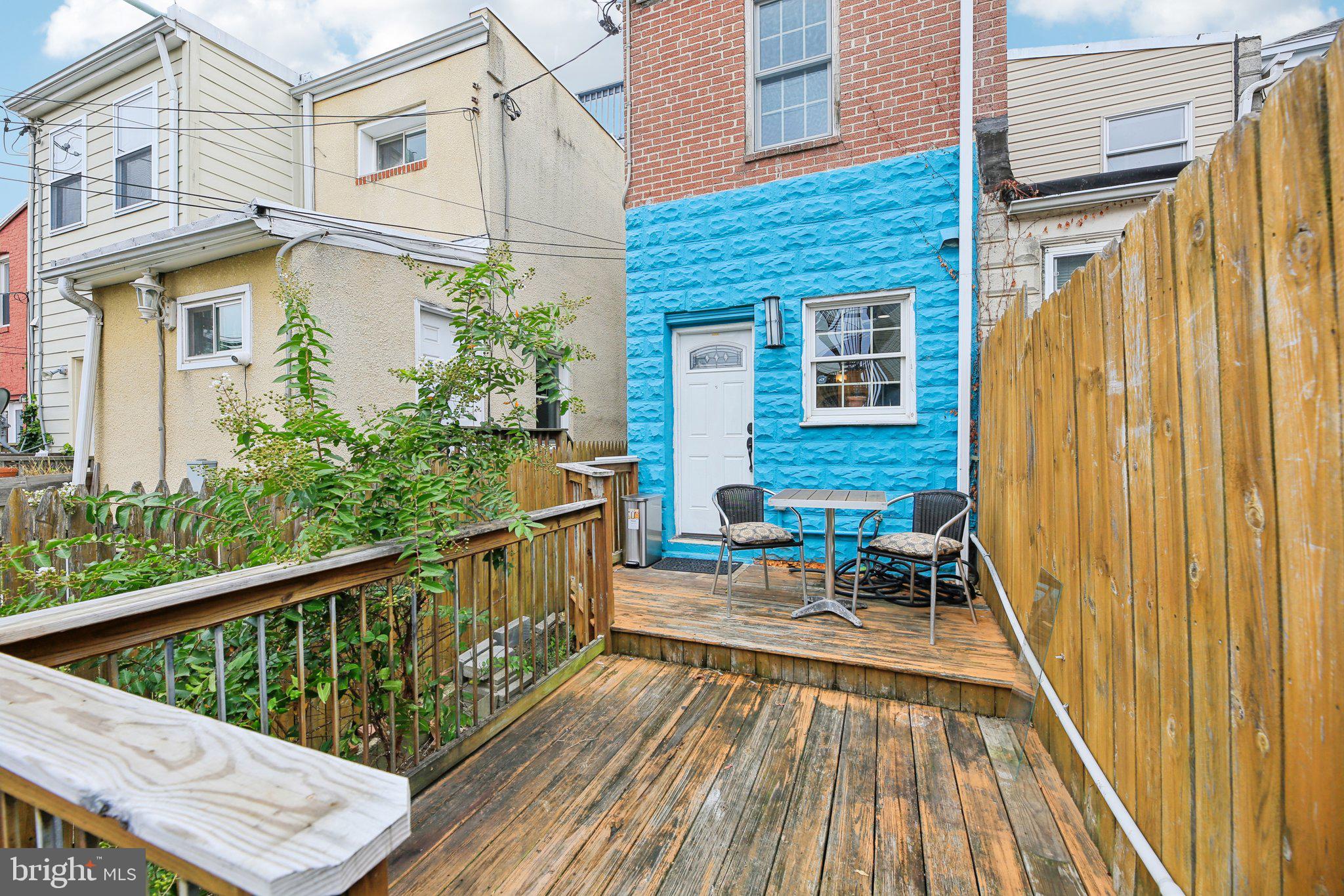 2341 Eastern Avenue Baltimore, MD 21224 - Photo 27 of 43 a balcony with wooden floor and furniture