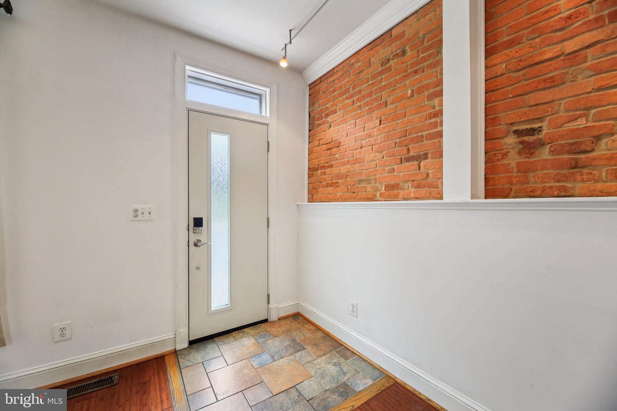 2341 Eastern Avenue Baltimore, MD 21224 - Photo 5 of 43 a view of an empty room with a window