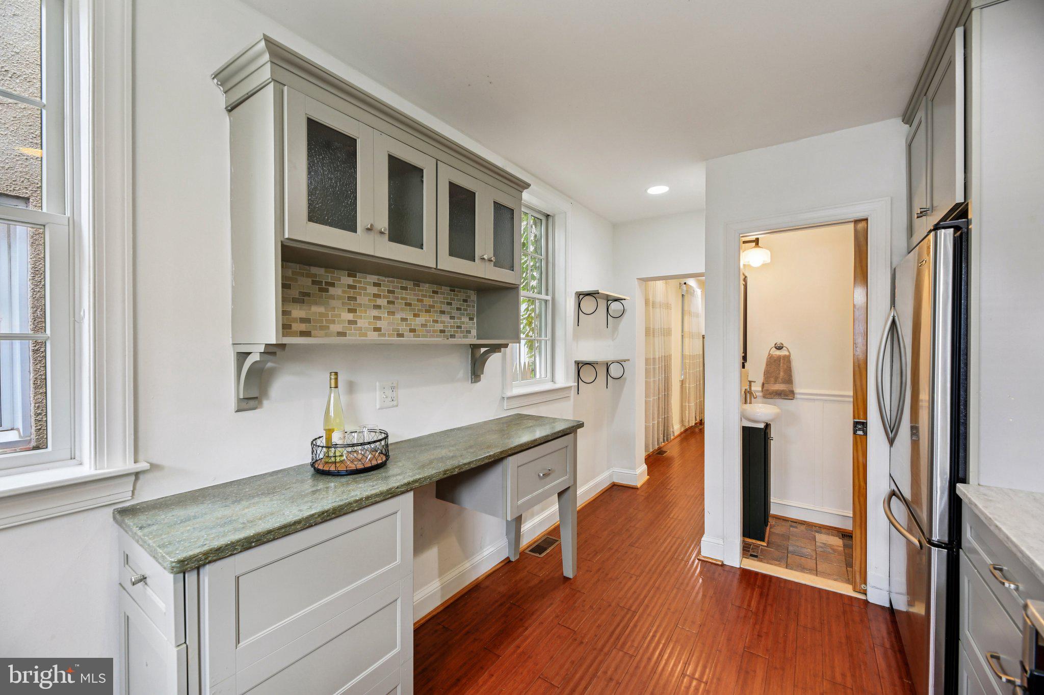2341 Eastern Avenue Baltimore, MD 21224 - Photo 10 of 43 a kitchen with stainless steel appliances granite countertop a refrigerator and a sink