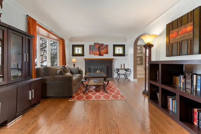 a living room with furniture fireplace and rug