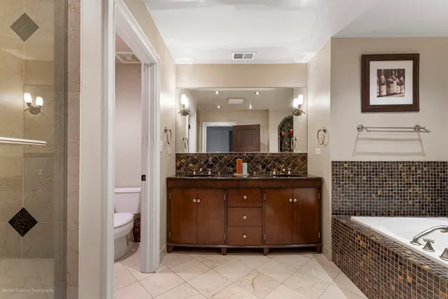 a kitchen with stainless steel appliances granite countertop a stove and a refrigerator