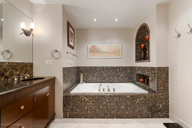 a bathroom with a bathtub and shower