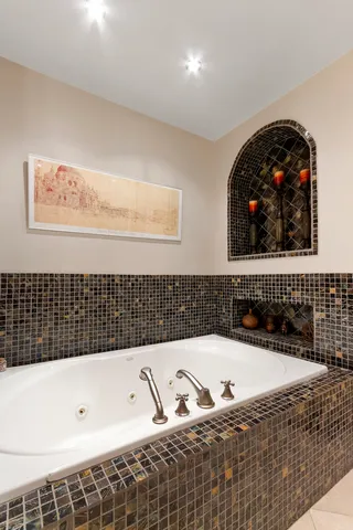 a bathroom with a bathtub and a shower