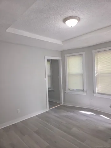 a bathroom with a toilet a sink and a window