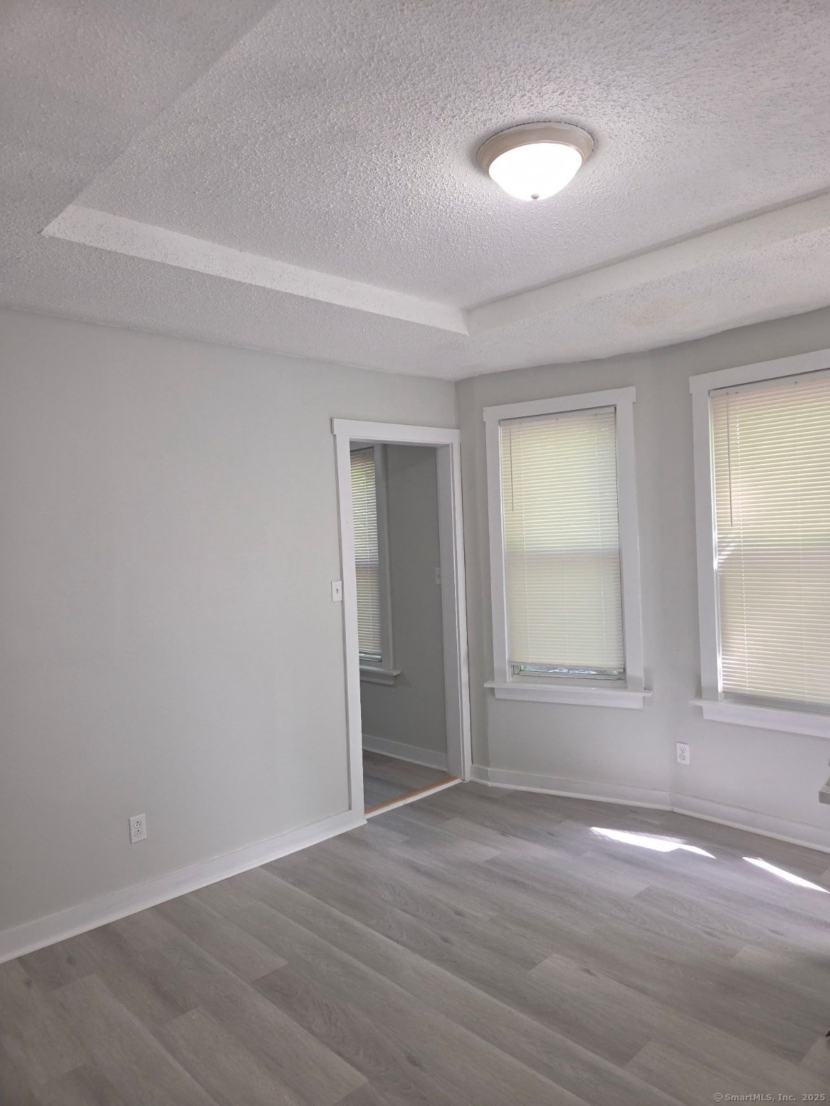 43 Gilbert Avenue New Haven, CT 06511 - Photo 12 of 14 an empty room with wooden floor and windows