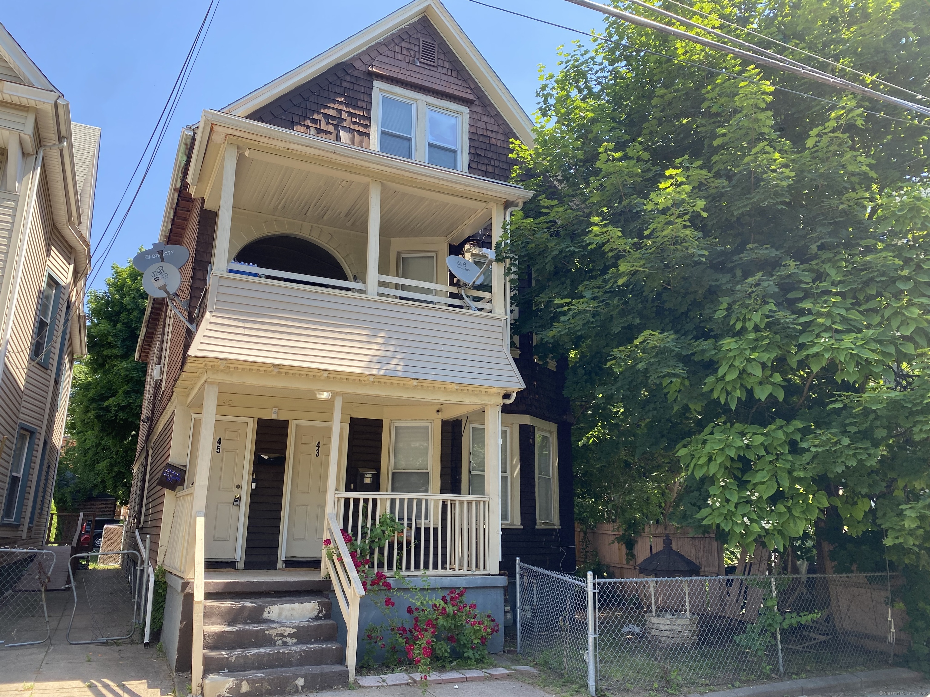 43 Gilbert Avenue New Haven, CT 06511 - Photo 2 of 14 a front view of a house with a porch