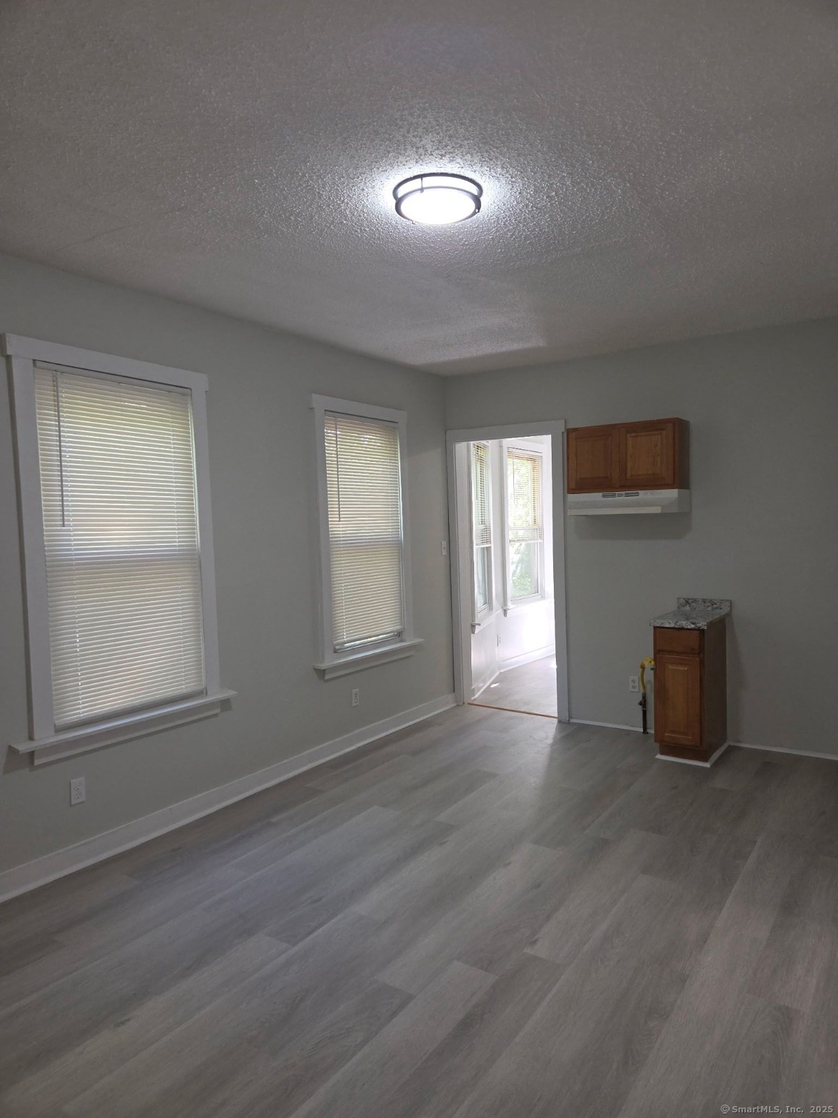 43 Gilbert Avenue New Haven, CT 06511 - Photo 6 of 14 a view of an empty room with wooden floor and a window
