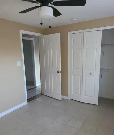 a white toilet sitting next to a bath tub