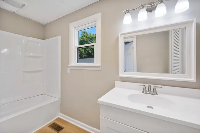 a bathroom with a sink and a bathtub
