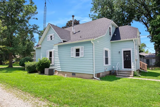 a aerial view of a house with a yard and plants