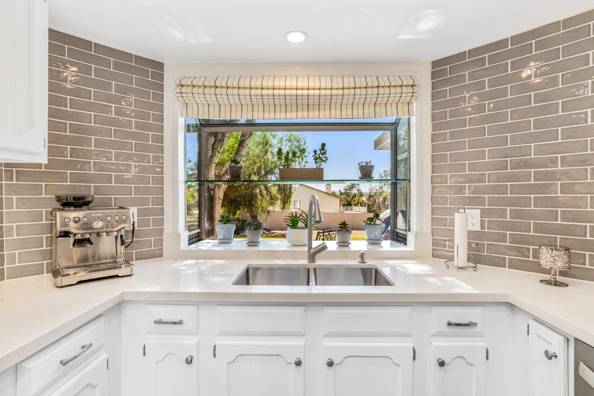 33727 Liberty Road Yucaipa, CA 92399 - Photo 11 of 39 a kitchen with a sink and a window