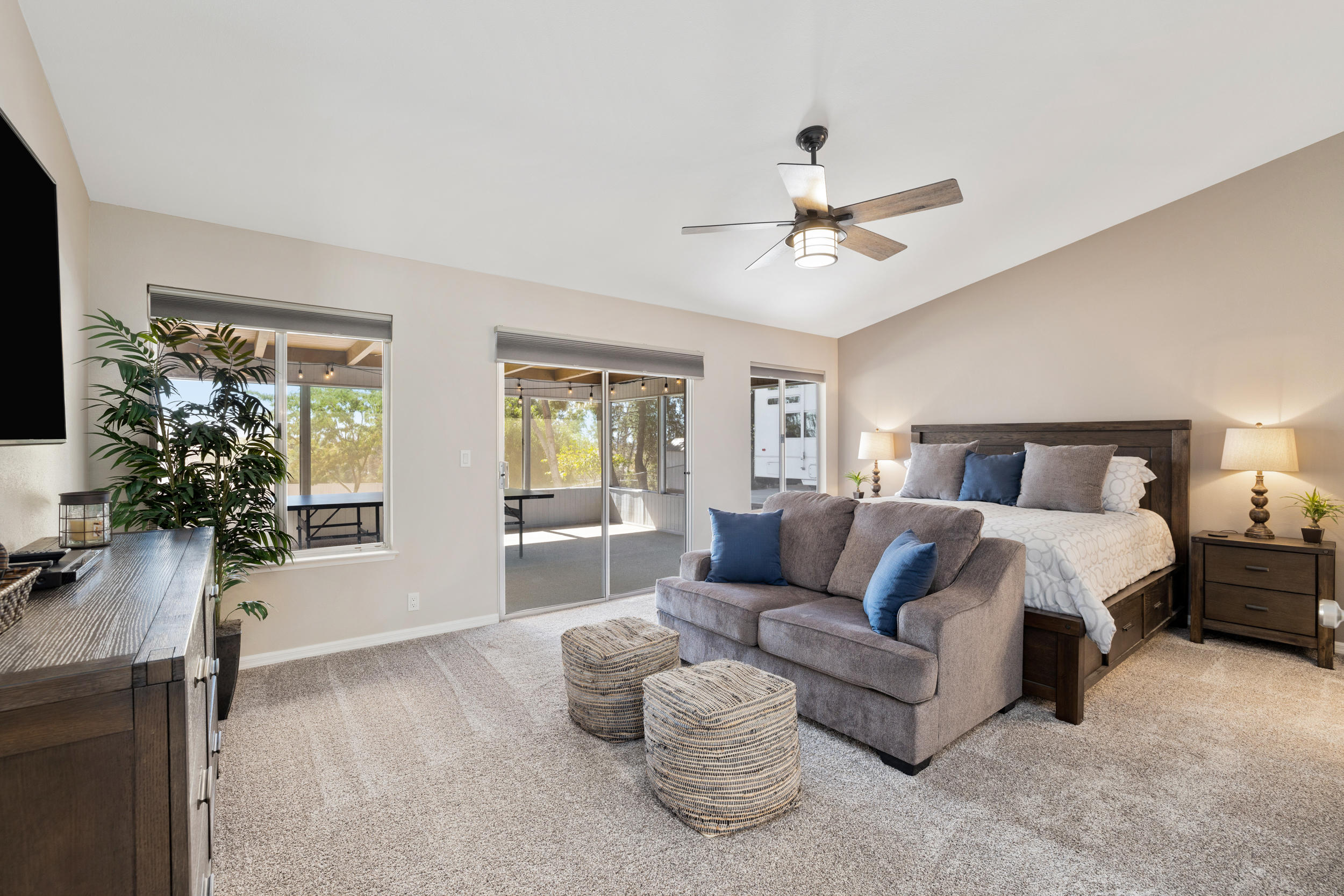 33727 Liberty Road Yucaipa, CA 92399 - Photo 12 of 39 a spacious bedroom with a bed and a couch